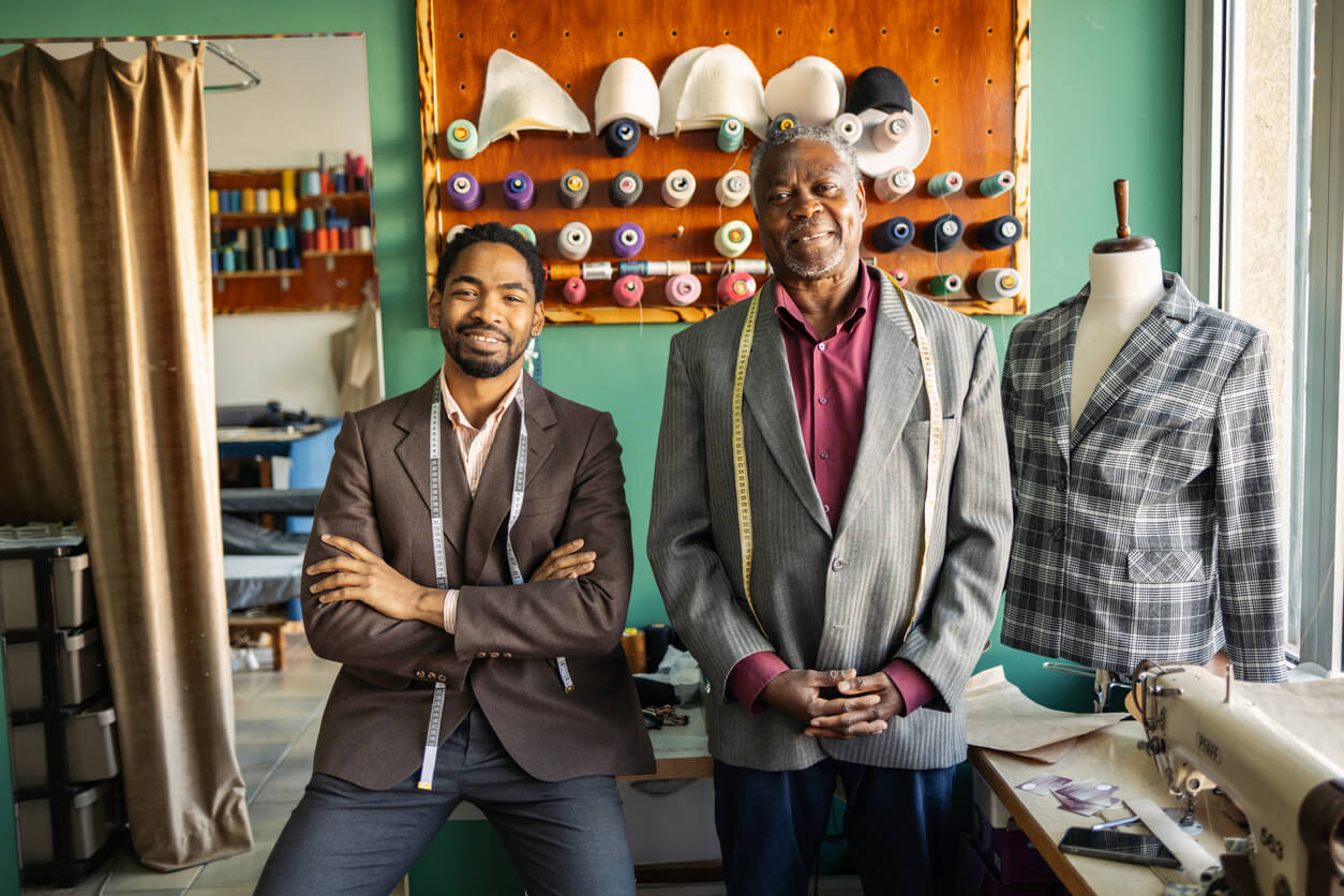 Boston-based family tailoring business owners supported by small business consulting services