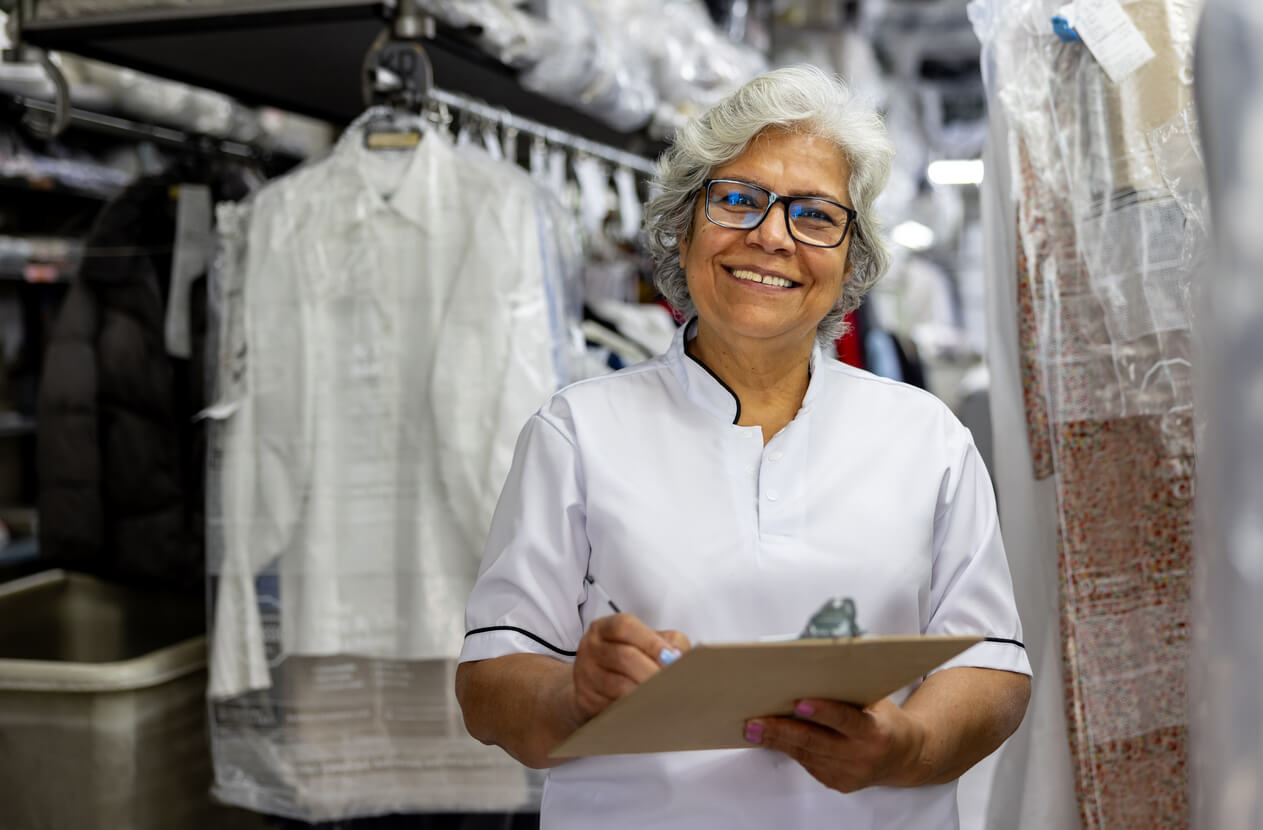 Boston laundry business owner working in operations, supported by small business advisory services